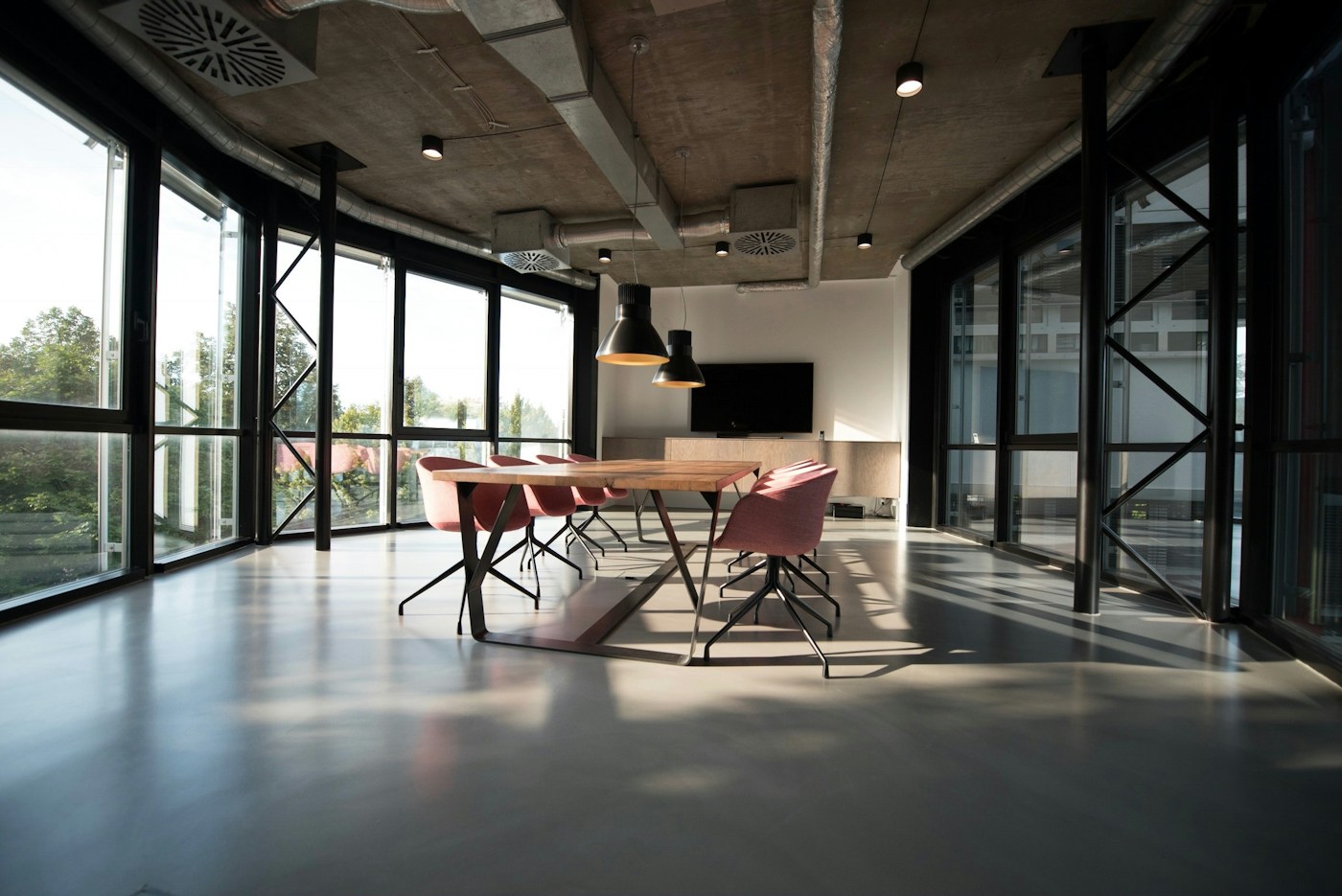 Contemporary office interior with open workspace and glass partitions